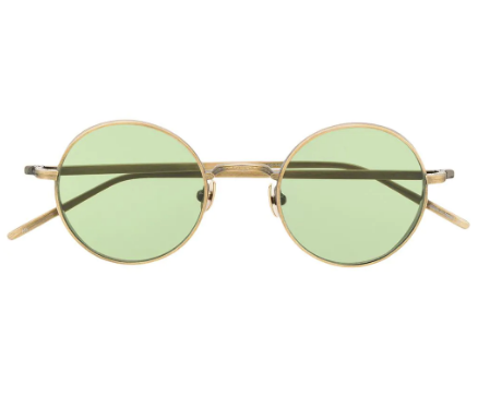 M3087 is a bold round sunglass with sculpted titanium temples and a wide titanium pressed rim featuring signature M+N details.